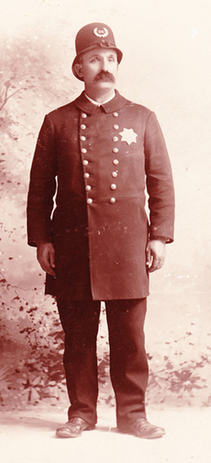 In this historical photo, Officer Griff Roberts wears a style of uniform that Portland police wore in the 1890s. Portland Police Museum image